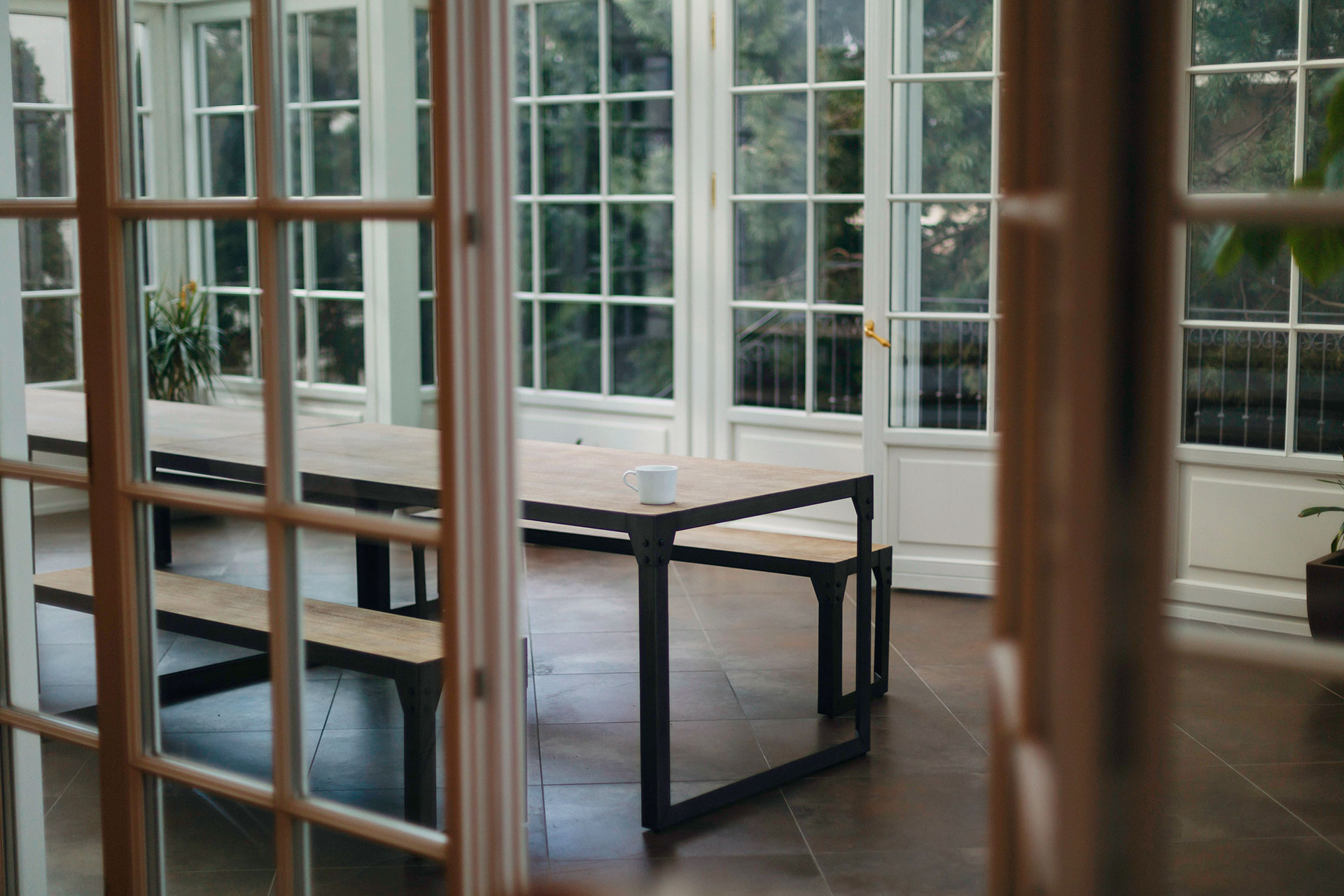 A beautiful room filled with windows brining in refreshing natural light.